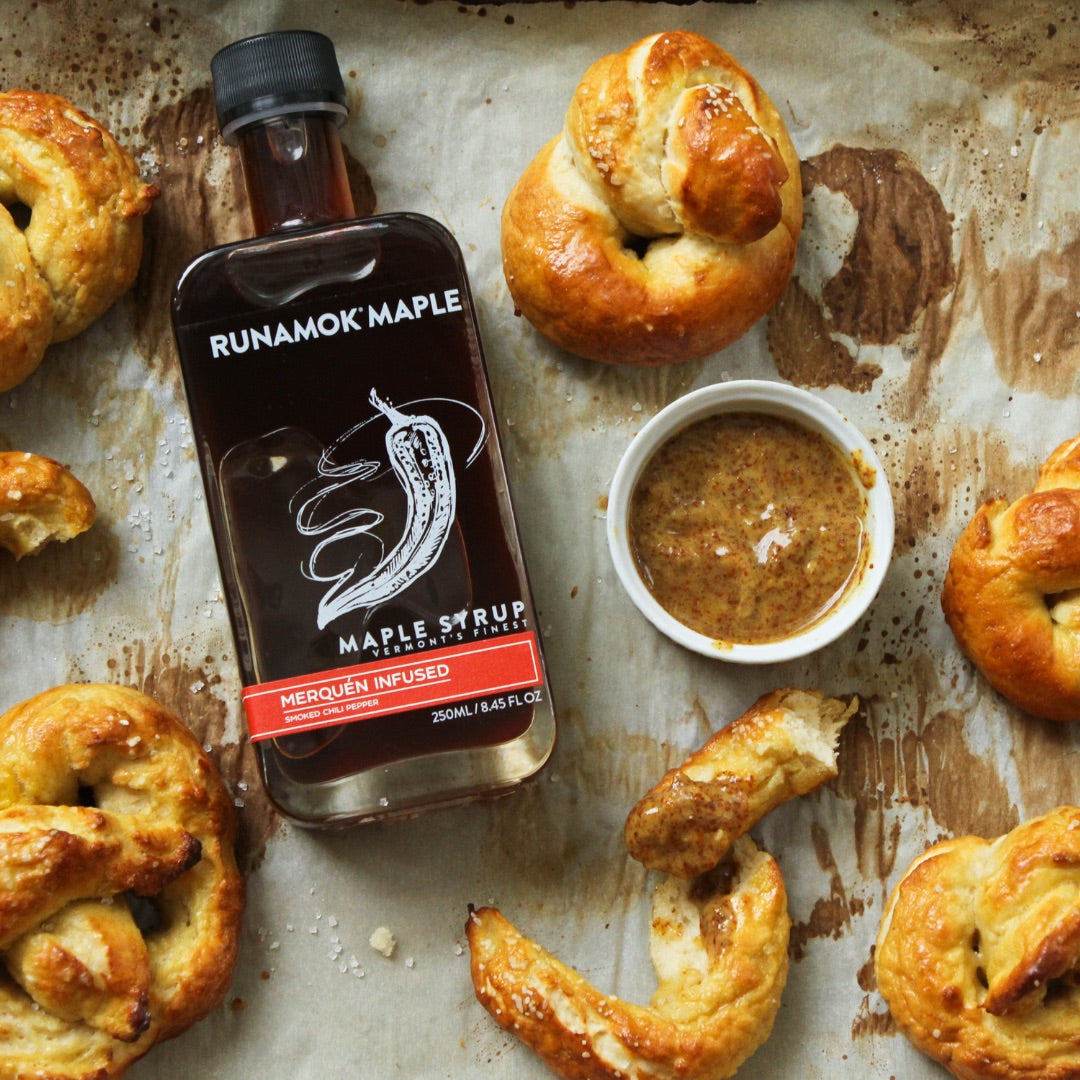 Home made pretzels with a bottle of Hot + Spicy Maple Syrup and dipping ramekin of spicy maple mustard