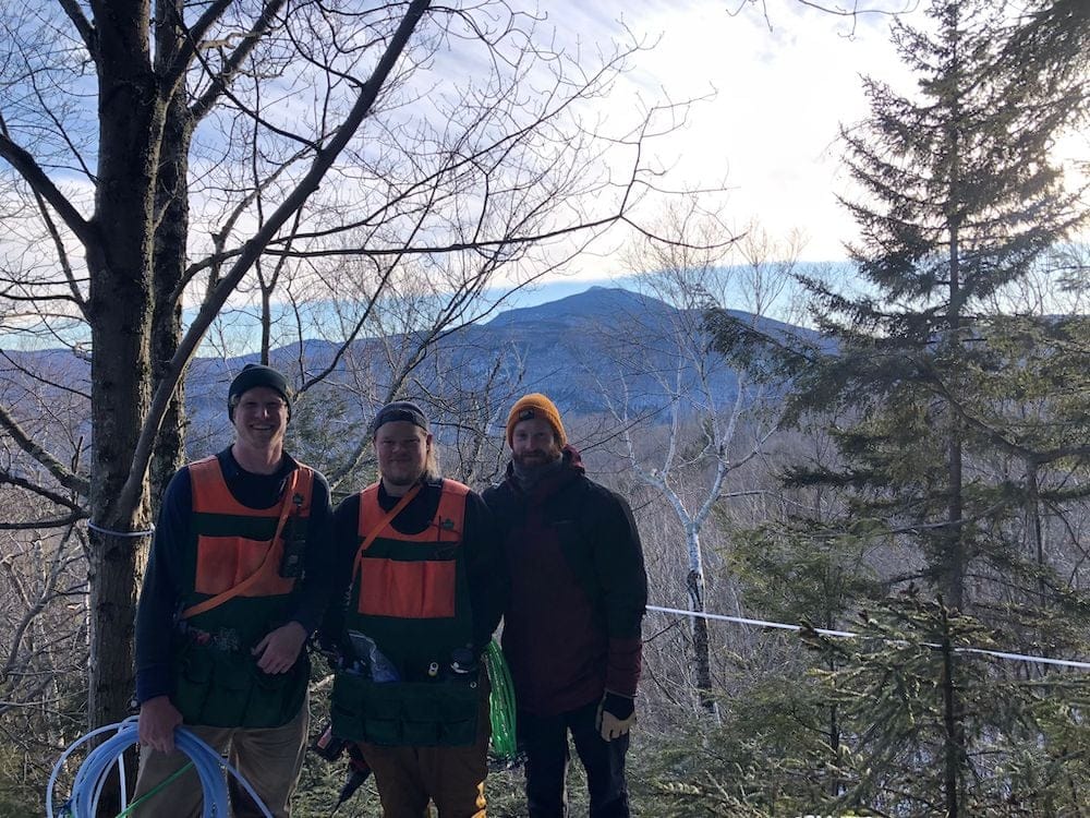 three members of the woods crew out on the mountain