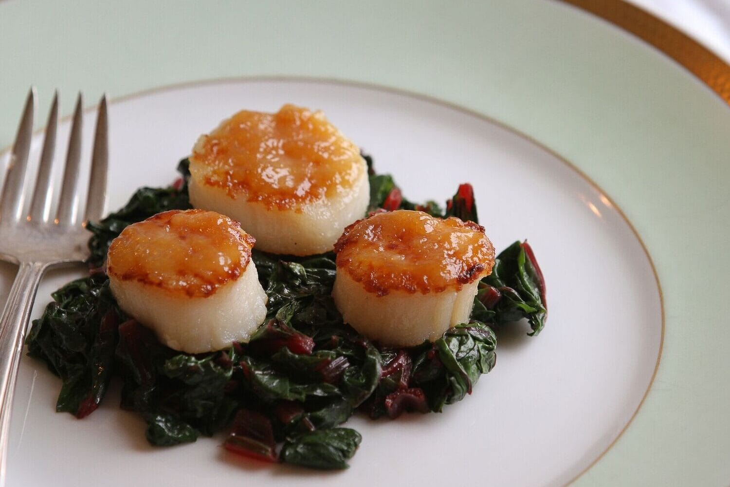 Seared Scallops with a Maple Miso Glaze over Swiss Chard