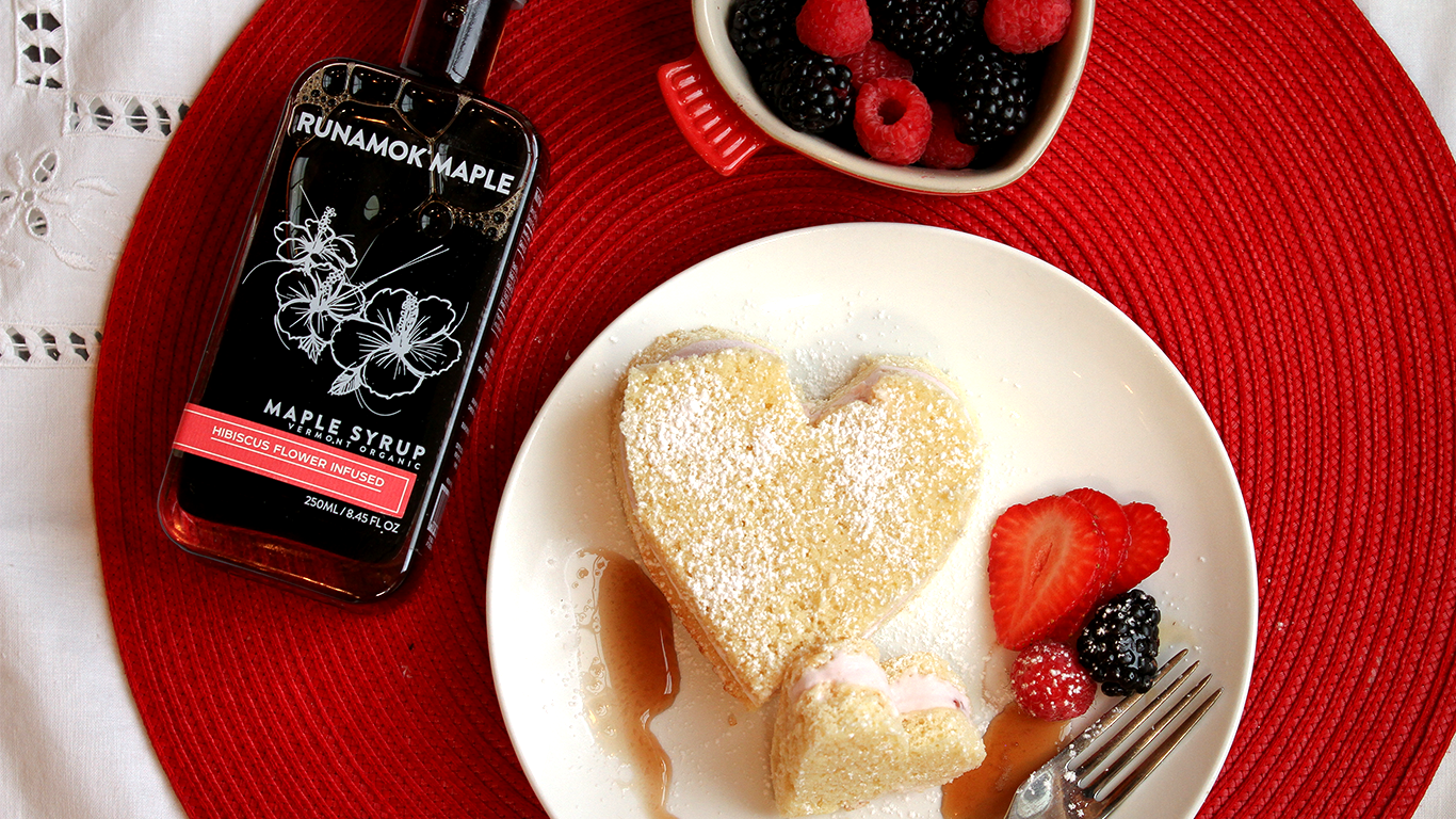 Ice cream cake served with berries and drizzled with hibiscus infused maple syrup