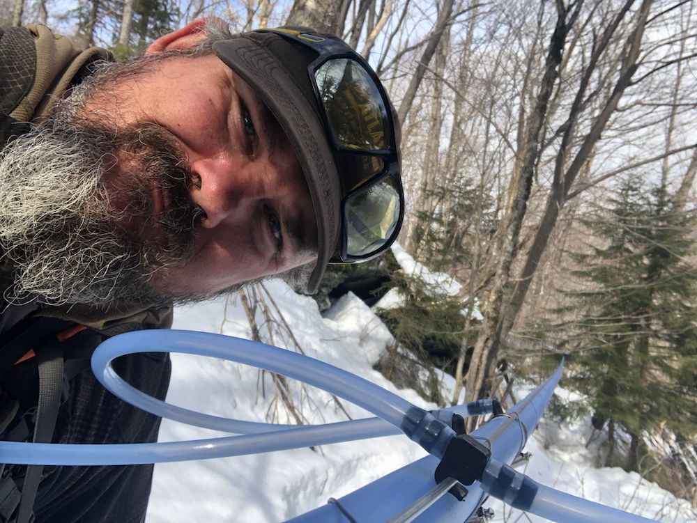 David Aronson, woods crew lead posing with a tapline